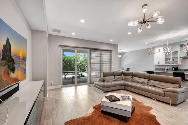 tiled living room with an inviting chandelier and sink