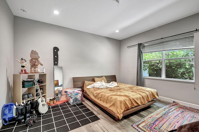 bedroom featuring hardwood / wood-style flooring