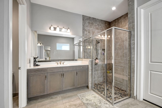 bathroom with vanity and walk in shower