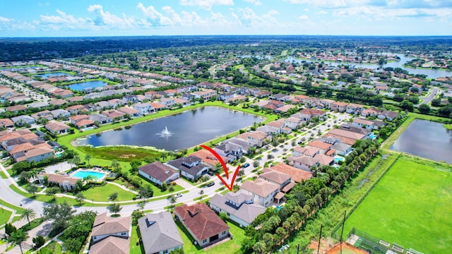 birds eye view of property featuring a water view