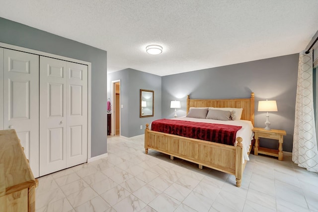 bedroom featuring a closet and a textured ceiling