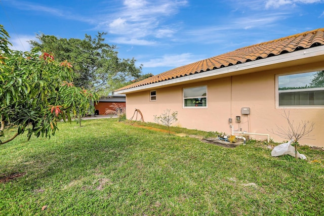 view of home's exterior featuring a lawn