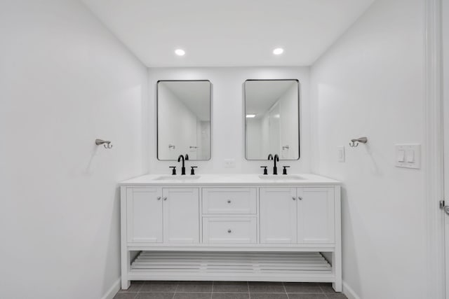 bathroom with tile patterned flooring and vanity