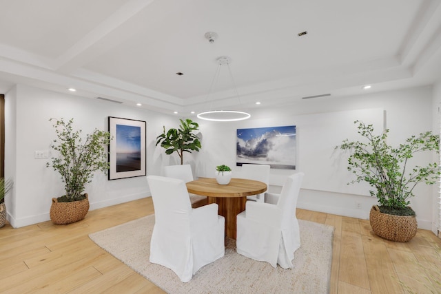 dining space with hardwood / wood-style flooring