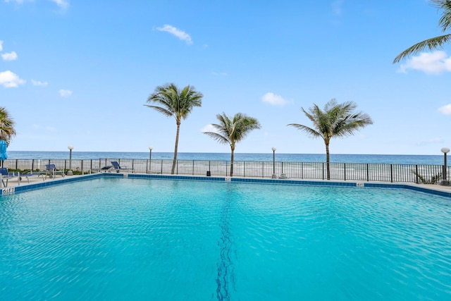 view of pool with a water view