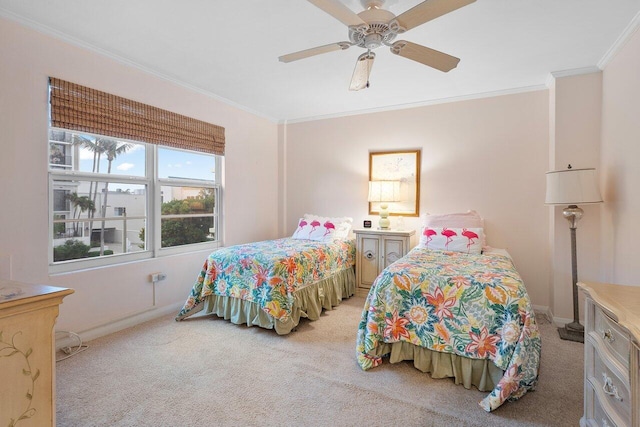 carpeted bedroom featuring ceiling fan and ornamental molding