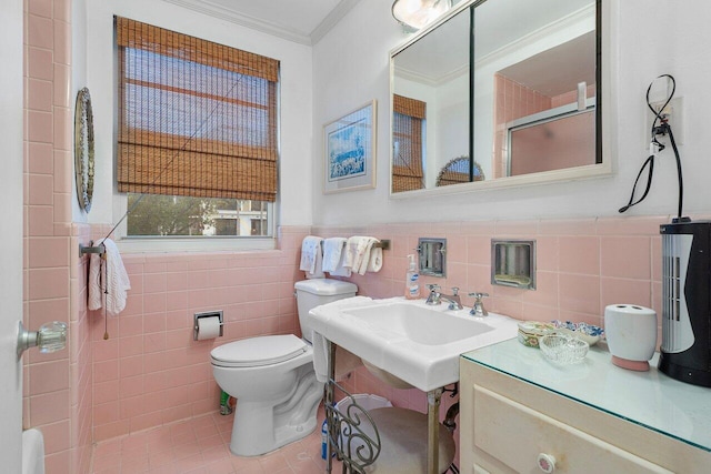 bathroom featuring ornamental molding, sink, tile walls, tile patterned flooring, and toilet