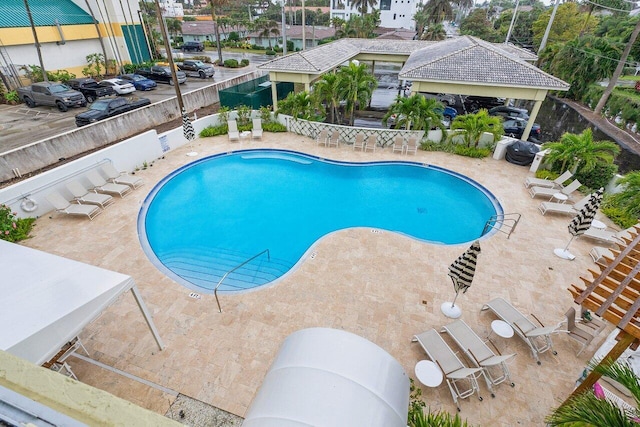 view of swimming pool featuring a patio