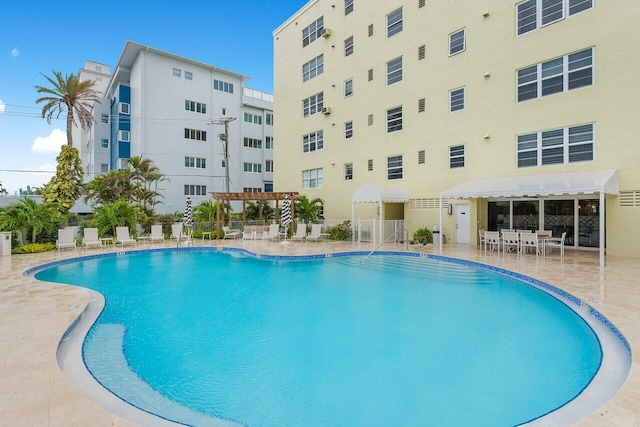 view of pool with a pergola and a patio