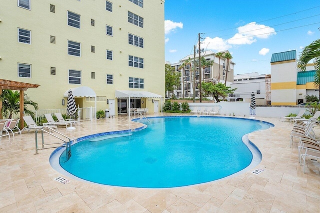 view of swimming pool with a patio