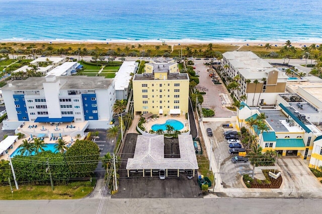 bird's eye view with a view of the beach and a water view