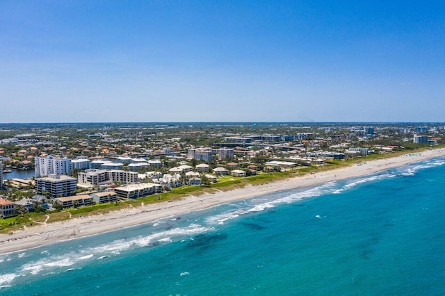 drone / aerial view with a view of the beach and a water view