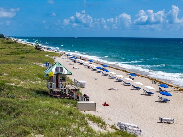 property view of water featuring a beach view