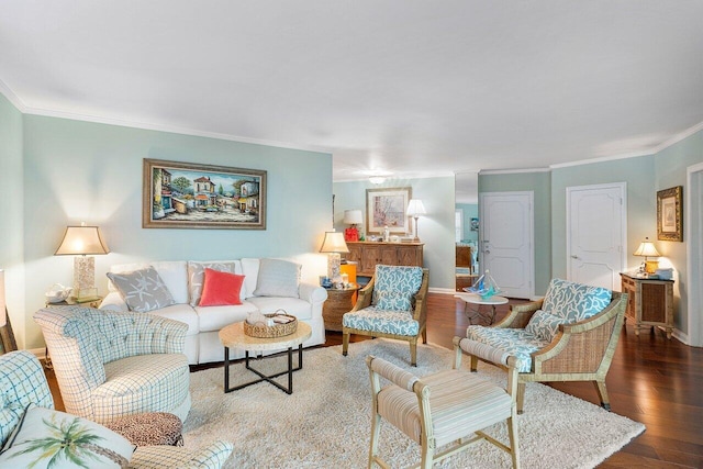 living room featuring hardwood / wood-style floors and crown molding