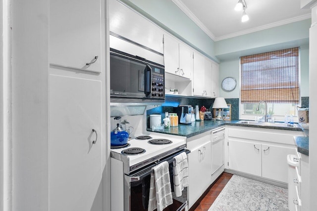 kitchen with white cabinetry, white appliances, sink, and tasteful backsplash