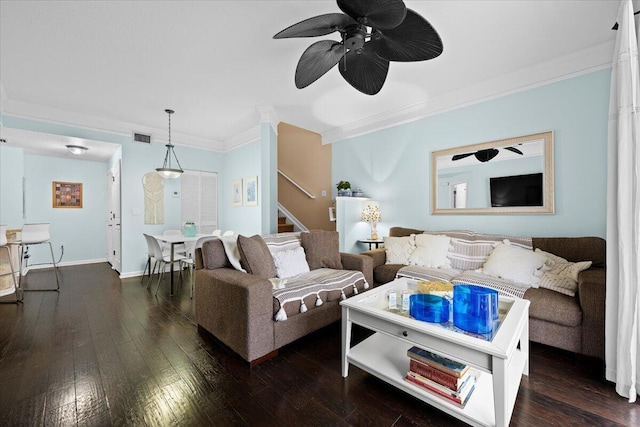 living room with ceiling fan, crown molding, and dark wood-type flooring