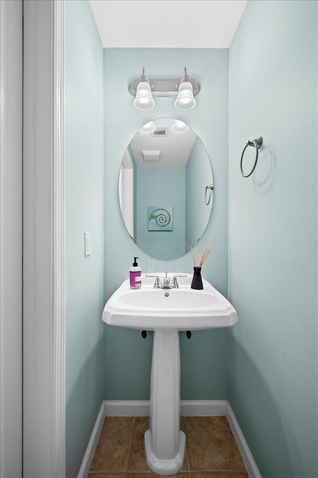 bathroom with tile patterned floors