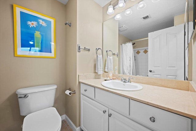 bathroom featuring vanity, toilet, a shower with shower curtain, and tile patterned flooring