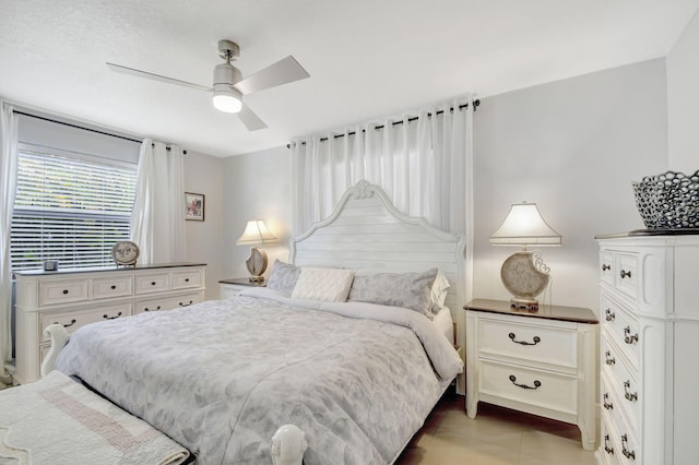 bedroom featuring ceiling fan and light tile patterned floors