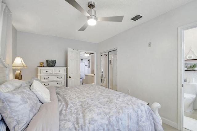 bedroom with ensuite bathroom, ceiling fan, and a closet