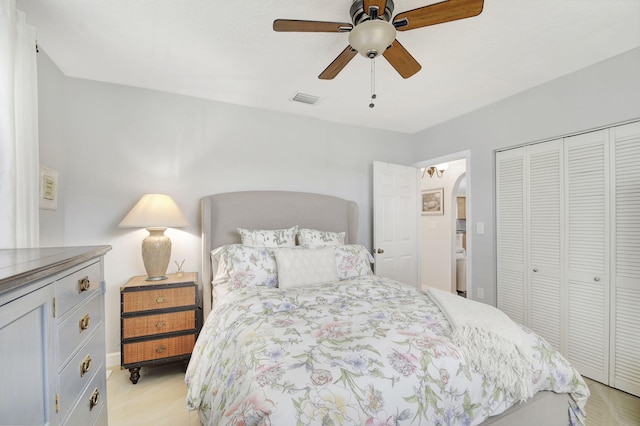 bedroom featuring ceiling fan and a closet