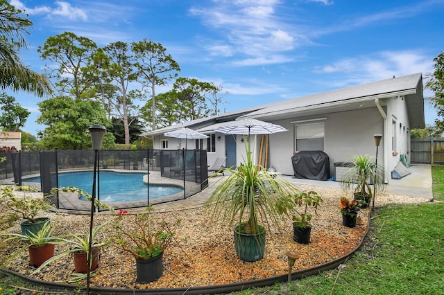 view of pool featuring a patio area and grilling area