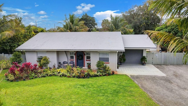 ranch-style home with a front lawn and a garage