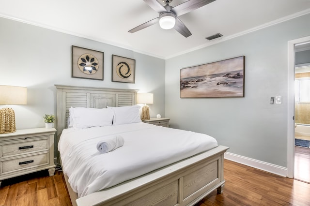 bedroom featuring ceiling fan, crown molding, and dark wood-type flooring