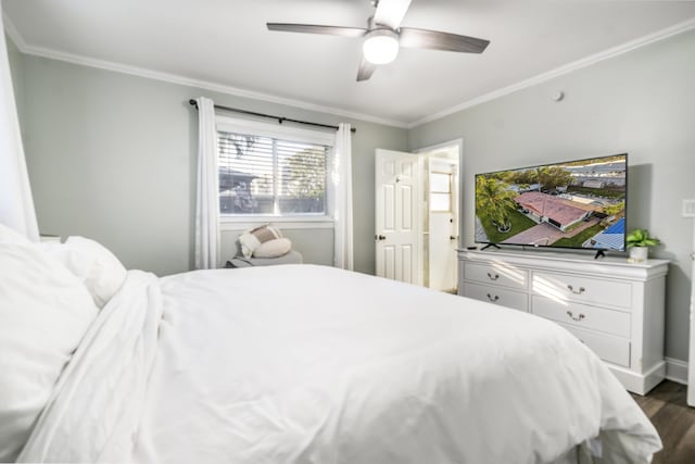 bedroom featuring ceiling fan, ornamental molding, and dark wood-type flooring