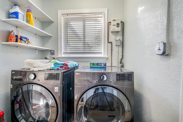 clothes washing area featuring washer and clothes dryer