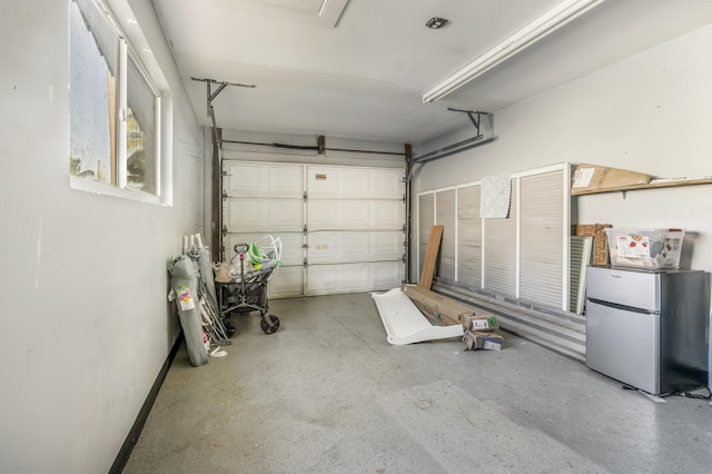 garage featuring stainless steel fridge