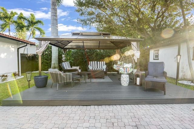 wooden terrace with a gazebo and an outdoor hangout area