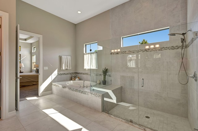 bathroom featuring tile patterned floors and plus walk in shower