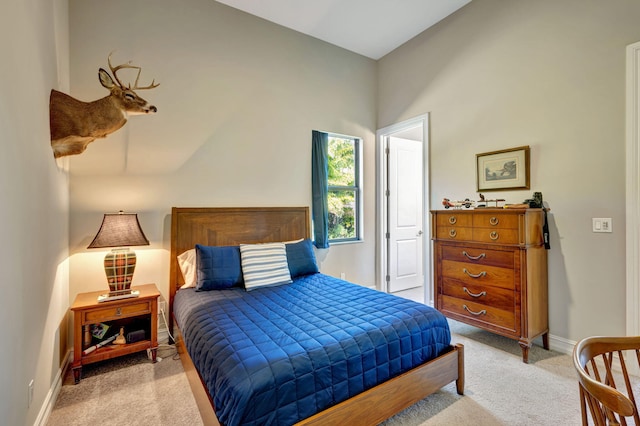 bedroom with light colored carpet