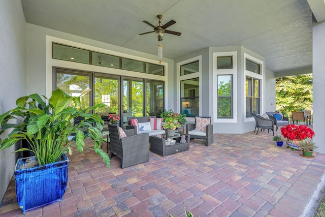 view of patio / terrace with an outdoor living space and ceiling fan