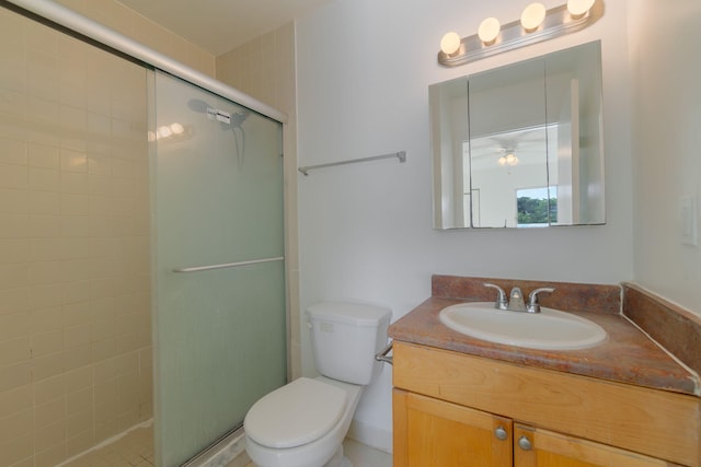 bathroom featuring vanity, toilet, and walk in shower