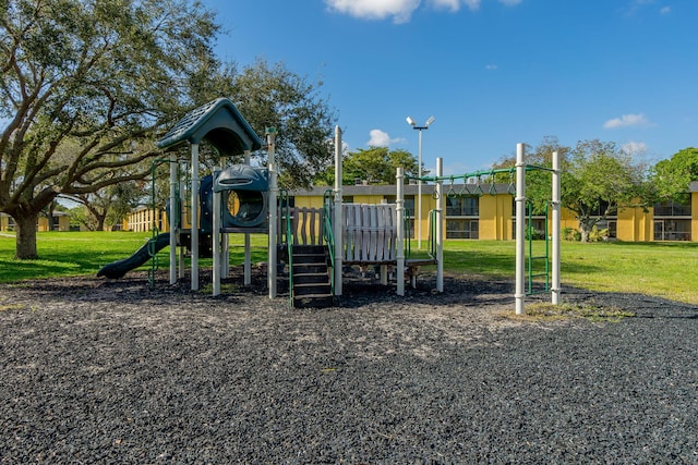 view of jungle gym featuring a lawn