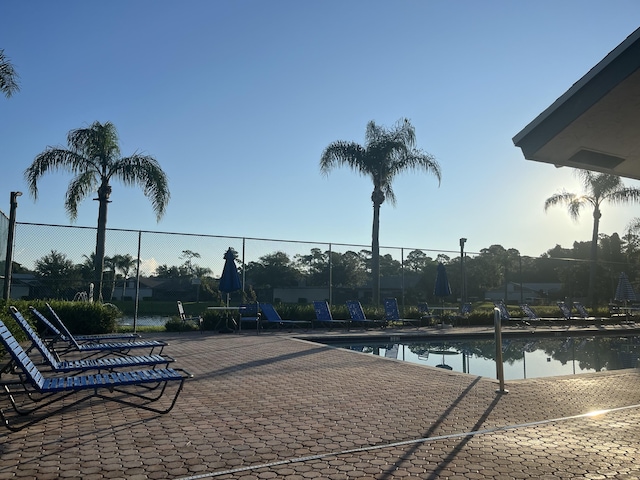 view of pool with a water view