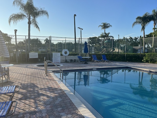 view of swimming pool with a patio area