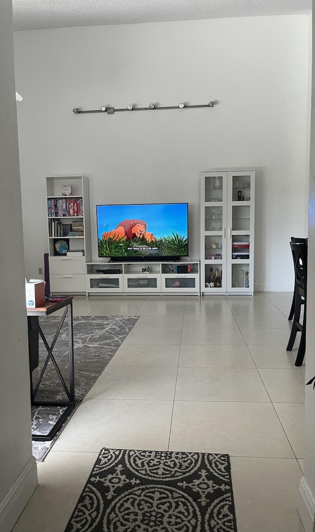 living room with tile patterned flooring