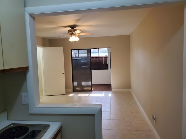 kitchen with ceiling fan and light tile patterned floors