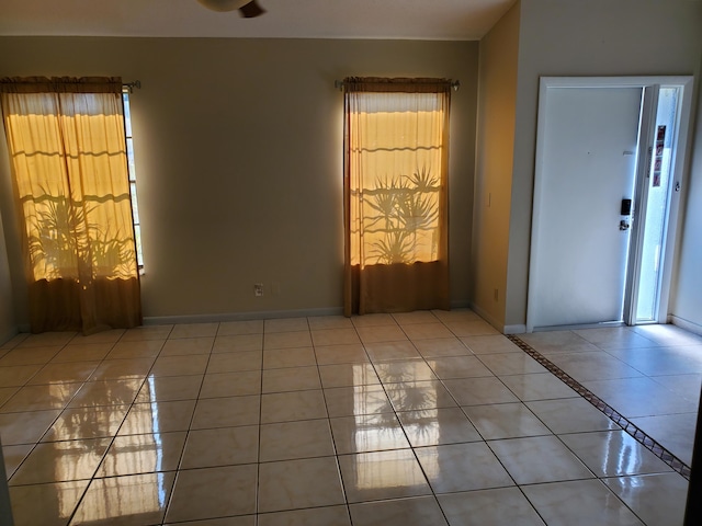 unfurnished room with tile patterned floors