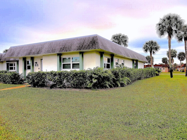 view of front of home with a lawn