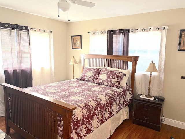 bedroom featuring ceiling fan and dark wood-type flooring