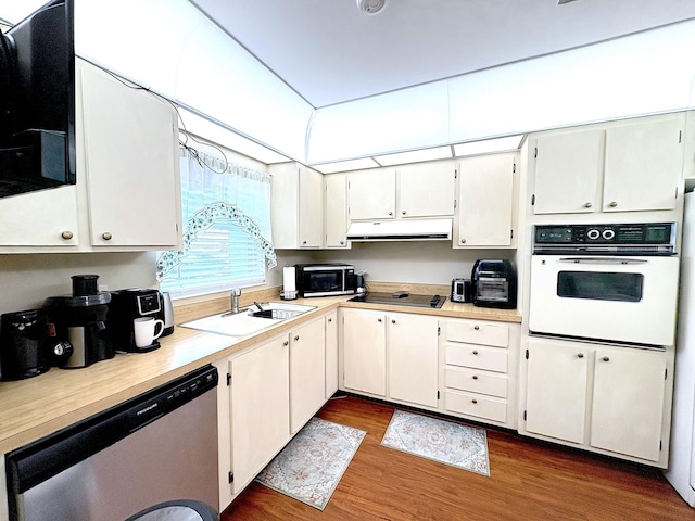 kitchen with white cabinetry, sink, stainless steel dishwasher, and oven