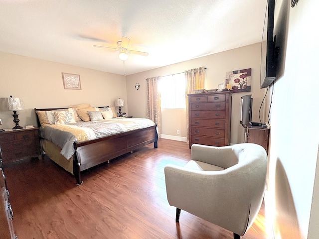 bedroom featuring ceiling fan and hardwood / wood-style flooring