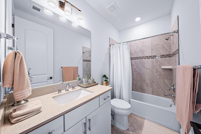 full bathroom with toilet, tile patterned flooring, shower / bath combo with shower curtain, and vanity