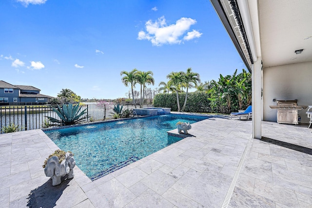 view of pool with a patio, a grill, pool water feature, an in ground hot tub, and a water view