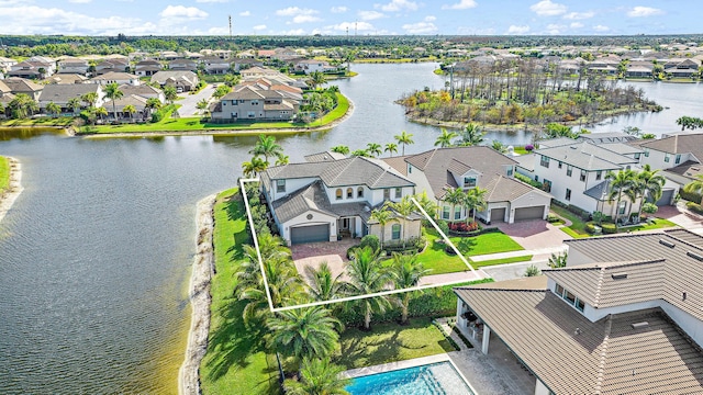 birds eye view of property featuring a water view