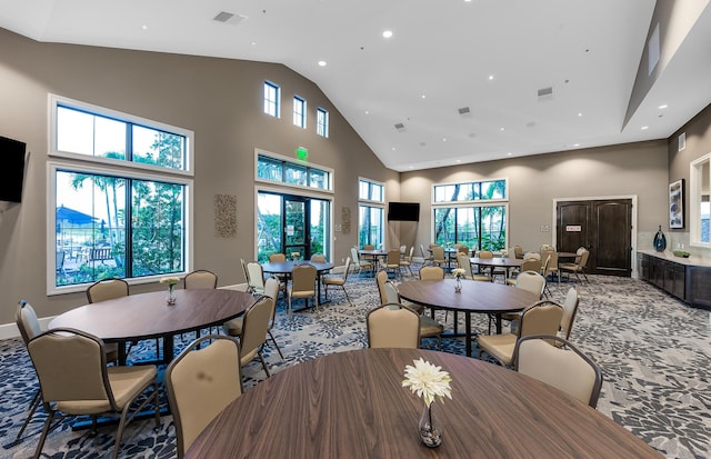 dining room with a high ceiling